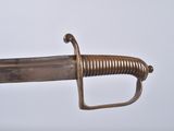 an old sword with a metal handle on a white background