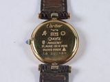 a watch that is sitting on a white surface