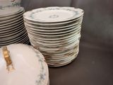 many plates stacked on top of each other on a table