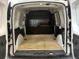 a white van with a wooden floor in the back of it
