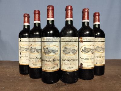 six bottles of wine are lined up on a table