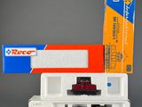 a toy train that is sitting next to a box