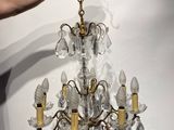an image of a person holding a crystal chandelier in their hand