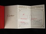 a red folder with a certificate on it on a black surface