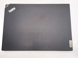 a laptop that is sitting on a white surface