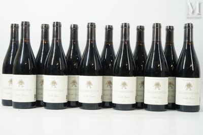 six bottles of wine are lined up in a row on a table