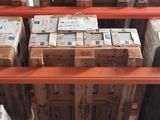 a large amount of boxes on the shelves in the warehouse