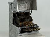 an old fashioned cash register with many coins in it