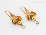 an image of a pair of gold earrings with oplite and pearls