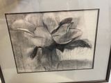 framed drawing of a flower in a vase on a table
