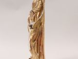 gold statue of a woman holding a child in her arms