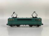 a close up of a toy train on a white surface