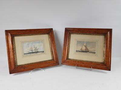 two framed prints of a sailboat and a sailing ship