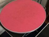 a table with a pink table cloth on top of it