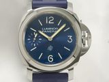 a close up of a watch on a white surface