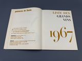 an open book with a picture of the grands and vins written in gold on it