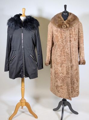 two coats on a mannequin stand, one with a fur collar and the other with a fur collar