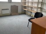 a room with a desk and a chair in it