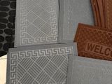 four mats on the floor with different designs on them