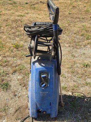 a blue pressurer that is sitting on the ground