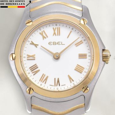 an image of a close up of a wrist watch with roman numerals
