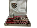 a silver box with silverware in it on a white background