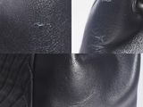 a close up of a pair of black leather shoes