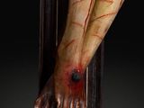 statue of jesus on the cross with blood on his face