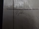 a close up of a piece of metal with writing on it