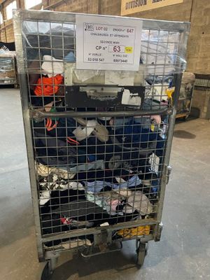 a metal cart with a lot of clothing on it