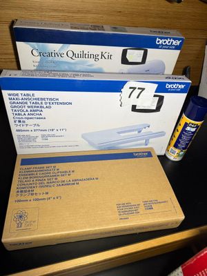 two boxes of paper and a can of glue on a desk