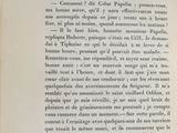 an open book with a black and white image of a cat