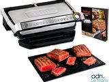 une photo d'un barbecue avec des steaks et un livre de cuisine