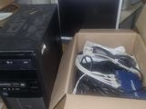 two computers sitting in a box on the floor