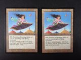 two cards that have a picture of a girl flying on a flying saucer