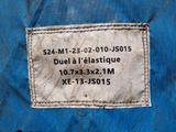 the label on the back of a blue piece of luggage