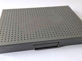 an image of a metal box with holes on it on a white surface