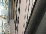 a picture of a jewelry store with many necklaces hanging on the wall