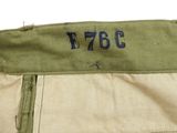 a close up of a pair of khaki pants with a tag on it