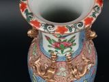 a vase that is sitting on a black surface