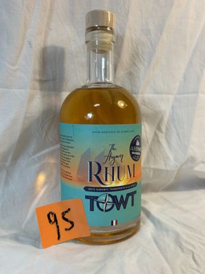 a bottle of alcohol sitting on a table with a price tag