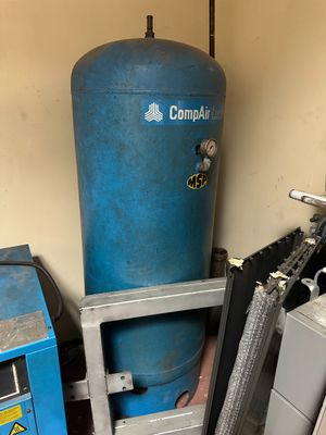 an image of a room with a blue tank and a blue machine