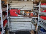 a room filled with lots of shelves and tools