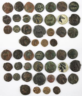 a collection of ancient roman coins on a white surface