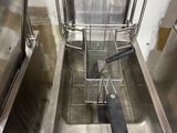 a deep fryer in the middle of a stainless steel sink