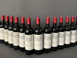 a group of bottles of wine lined up in a row
