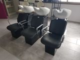 several black and white chairs are lined up in a room