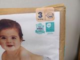a box of diapers with a picture of a baby on it