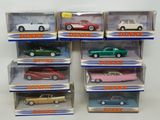 six different models of cars in a display case