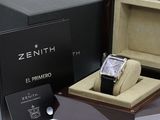 a box with a watch inside of it and a card in the box